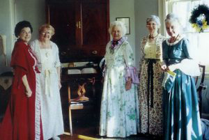 Members of Woman for Greater Philadelphia including chairman of the board Alma Jacobs don colonial garb for Yule tide celebration.